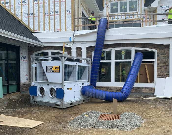 High-efficiency commercial HVAC system installation for REIC Rentals construction site.