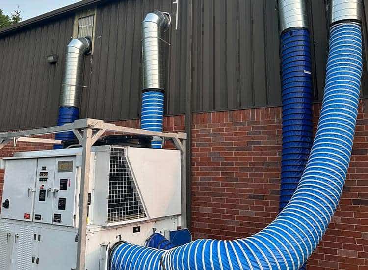 Industrial ductwork and HVAC ventilation system at REIC Rentals facility.