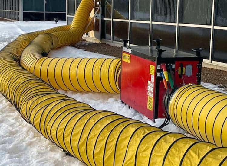 High-capacity HVAC ducting system outside building for commercial heating and cooling solutions.
