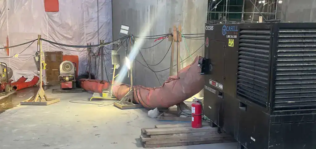 Industrial construction site with ductwork and equipment for rental properties.