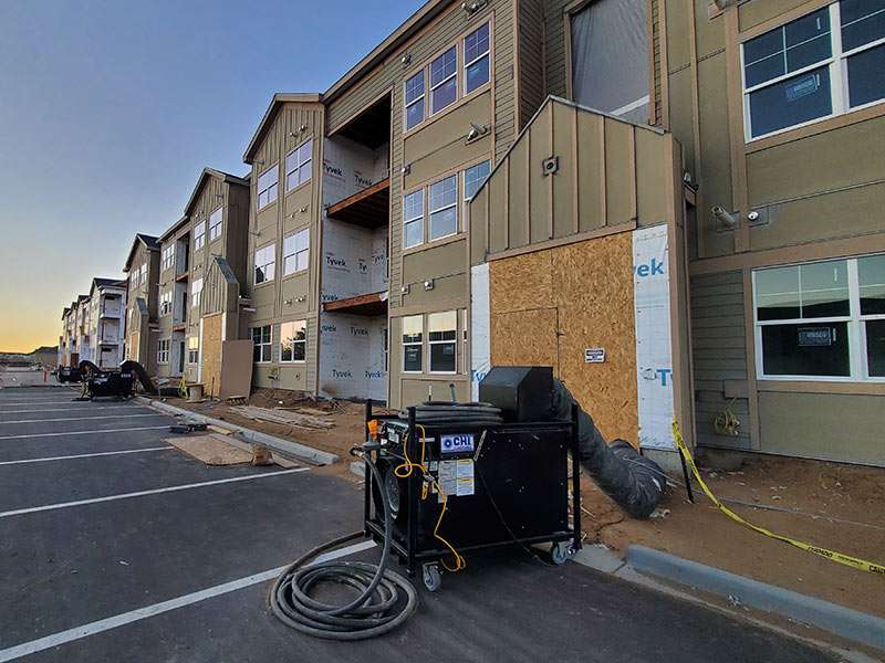 New apartment complex under construction with ongoing exterior work, ready for rental occupancy.