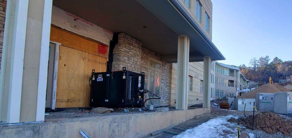 Construction site of residential rental units at REIC Rentals, ongoing building development.