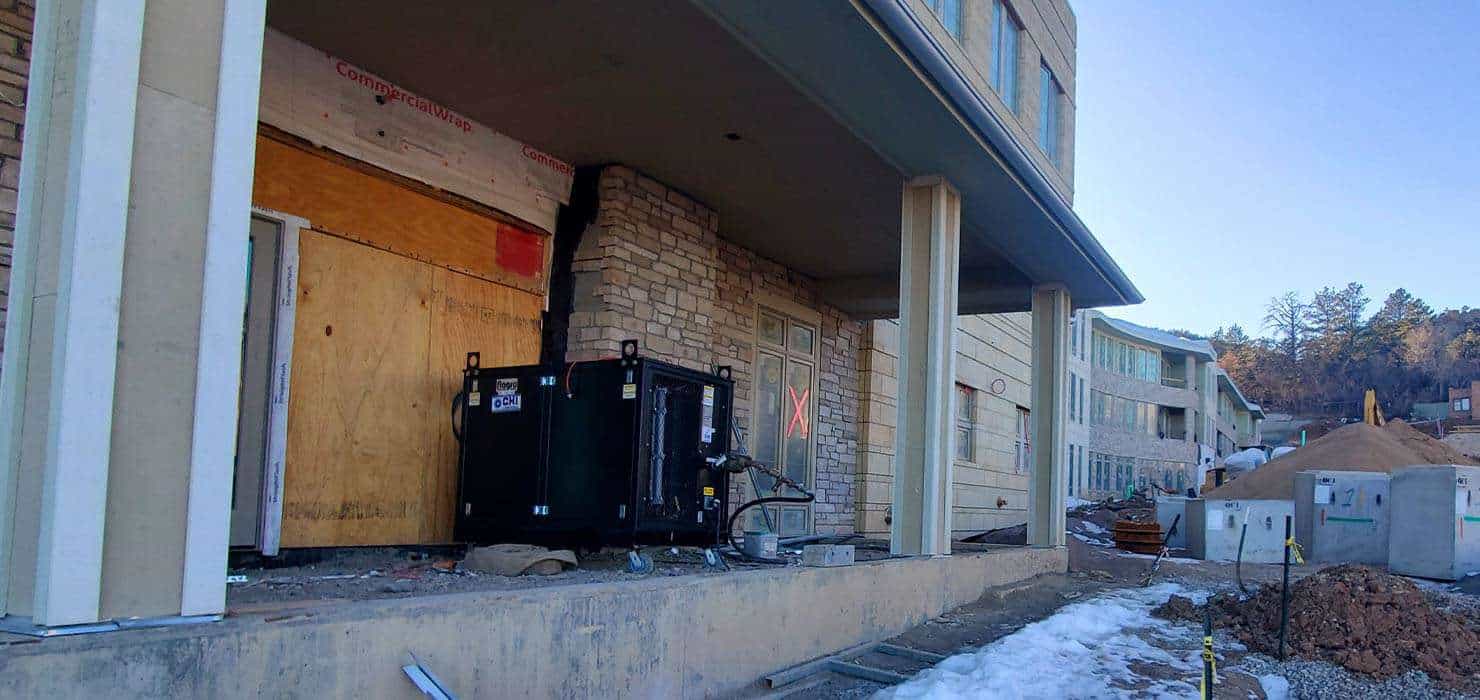 Construction site of residential rental units at REIC Rentals, ongoing building development.