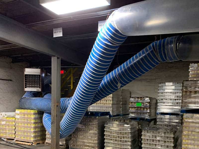 Industrial ventilation ducts in a storage or warehouse facility for efficient air circulation.