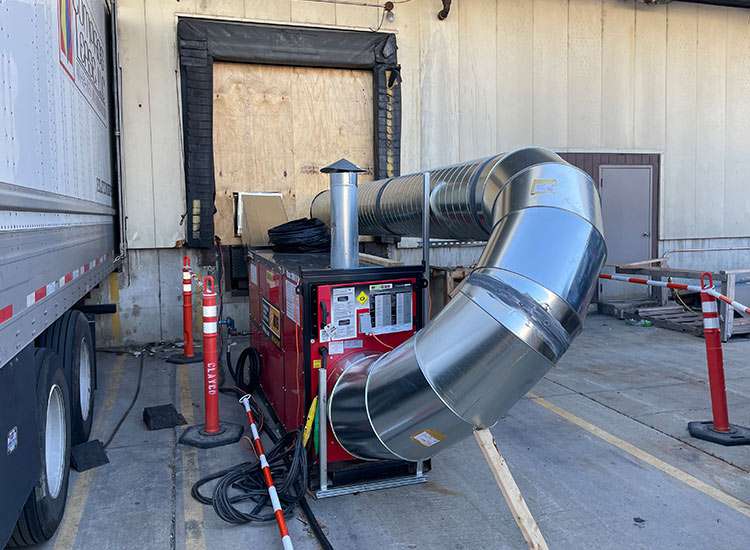 Industrial ventilation duct system with heating unit at REIC Rentals.