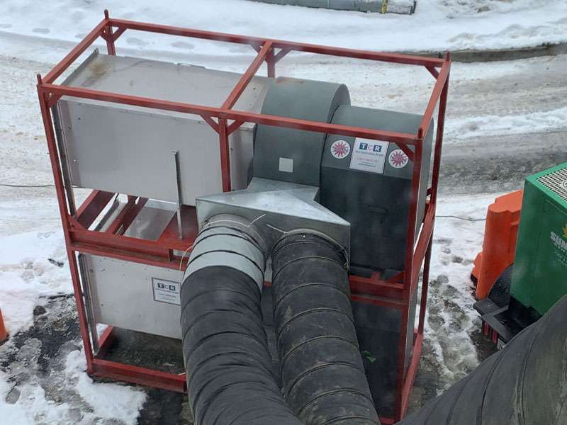 High-capacity industrial ventilation duct system in snowy outdoor setting, essential for commercial heating and air quality control.