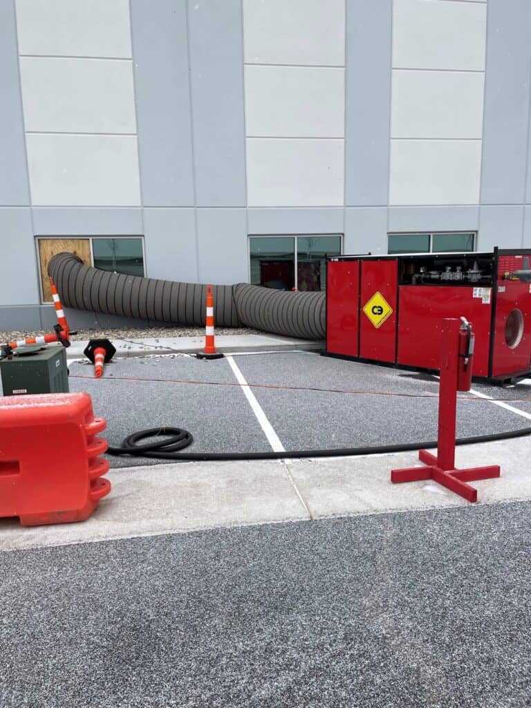 Damaged HVAC system vent pipe at a commercial property.