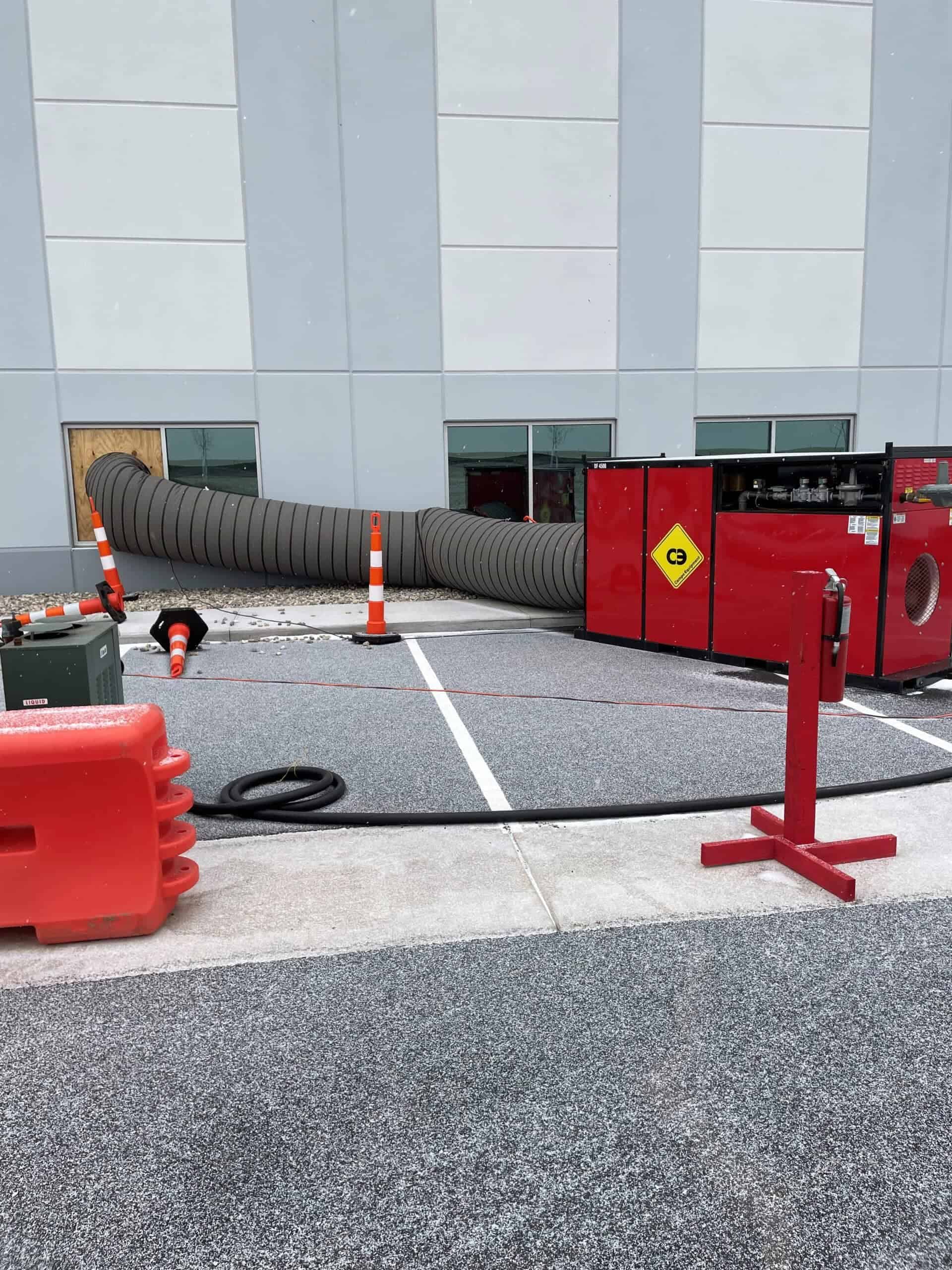 Damaged HVAC system vent pipe at a commercial property.