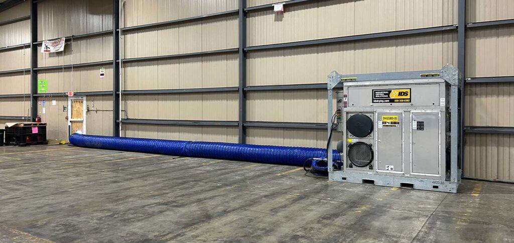 Flexible industrial air ventilation system in warehouse, part of REIC Rentals inventory.