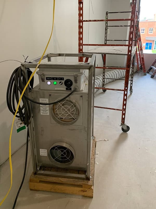 Electric HVAC equipment with ductwork on a construction site for rental purposes.