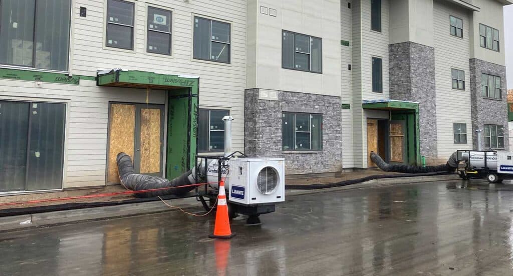 Temporary construction ventilation system at a new residential building under development.