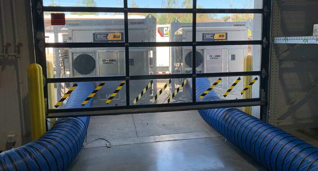 Flexible industrial HVAC exhaust ducts in a commercial setting for effective air ventilation.