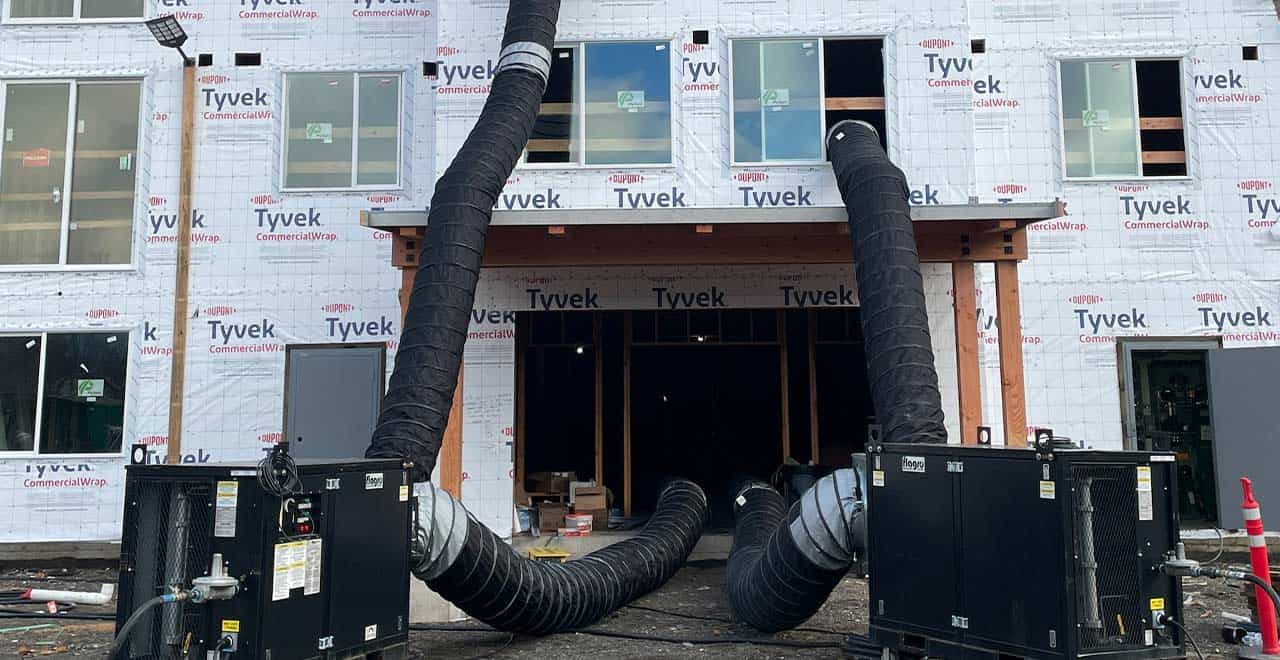 HVAC ductwork setup at construction site to reduce weather delays during Q1.