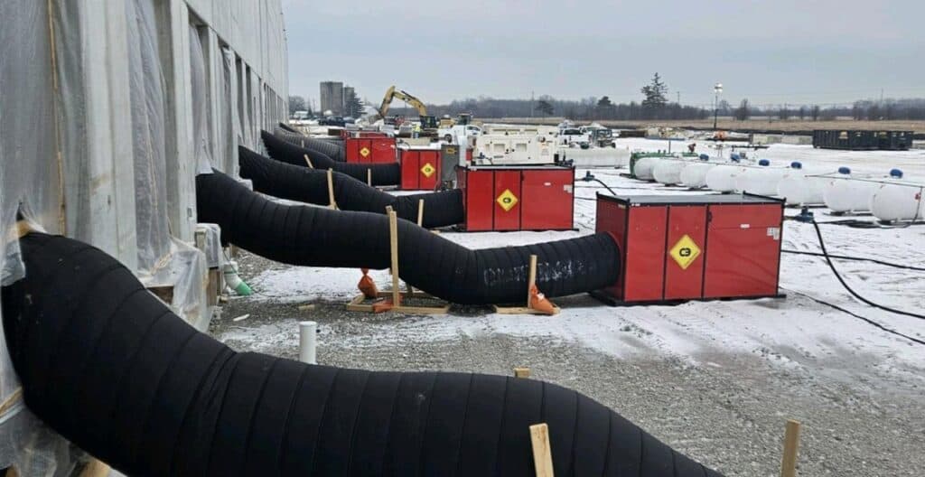 Fired heat units for efficient concrete curing in cold weather conditions.