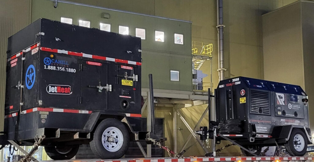 Mobile concrete curing heater used in extreme cold for construction projects.