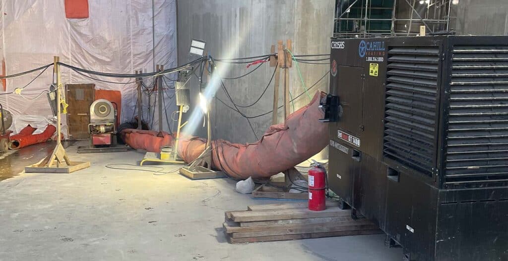 Concrete curing setup with insulation and heating for sub-zero construction projects.