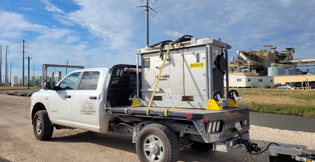 Dehumidification system on a service truck for moisture prevention in buildings.