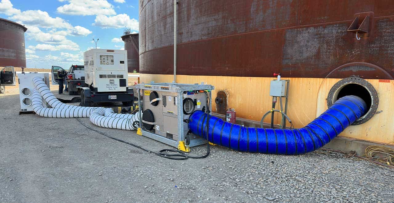 Industrial pumps and hoses used for fluid transfer at construction sites.