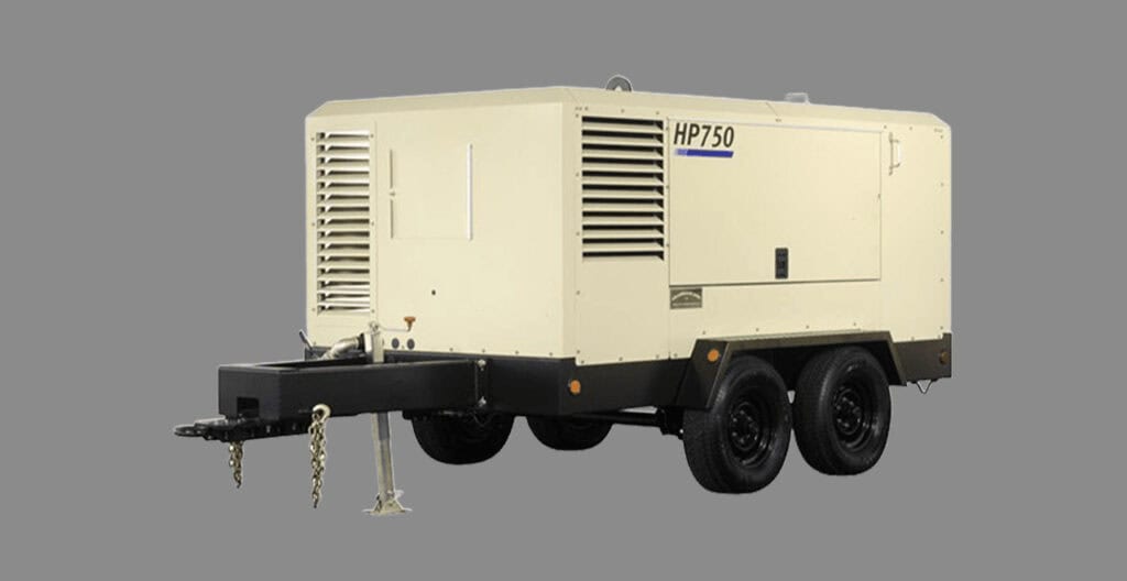 Industrial air compressor on construction site for reliable power supply.