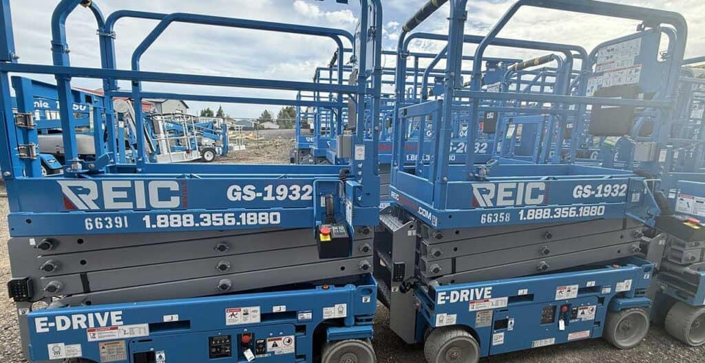 Scissor lifts available for rent at REIC, ideal for construction and maintenance projects.