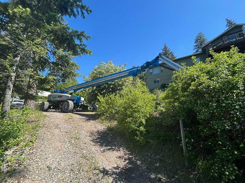 Elevated view of a construction crane near residential buildings in Bend.