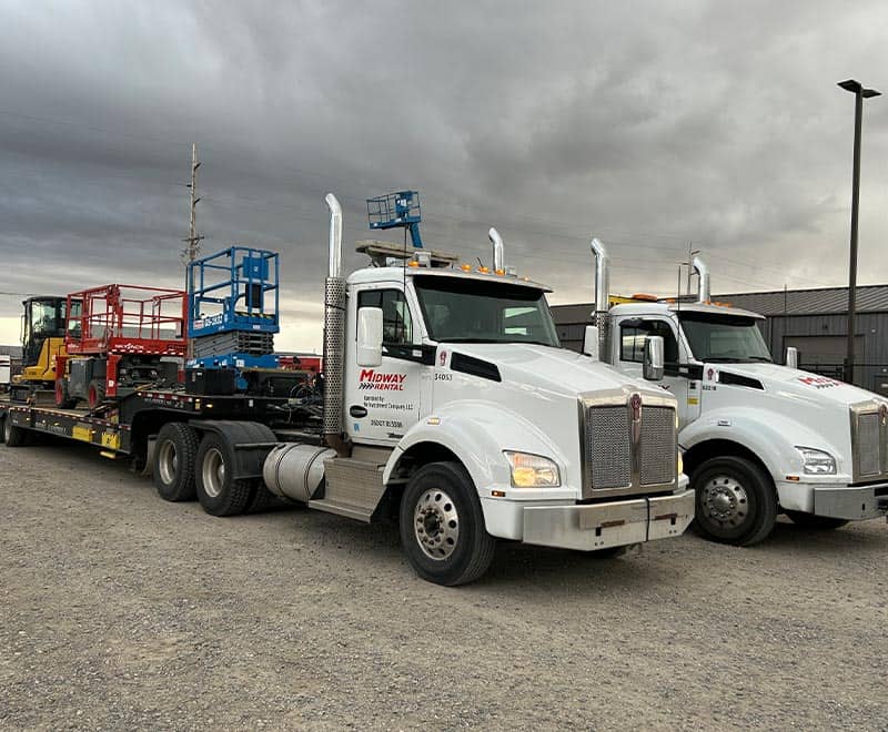 Heavy-duty trucks used for transporting construction and industrial equipment.