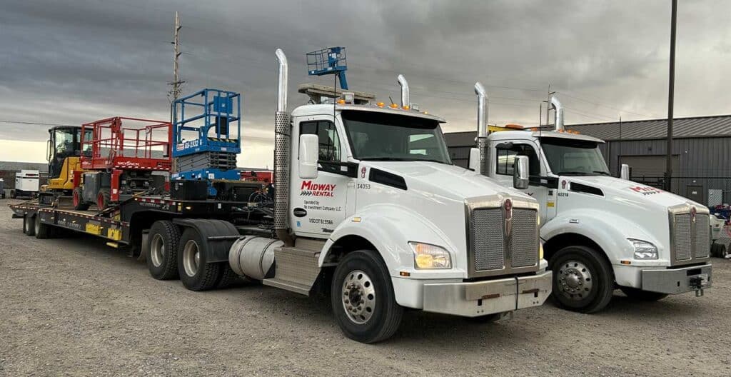 Heavy-duty rental trucks with construction equipment for complex projects.