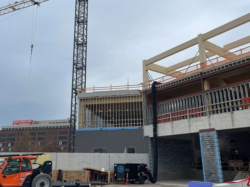 Construction site of REIC Rentals in Chaska, Minnesota, showing ongoing building development and str.