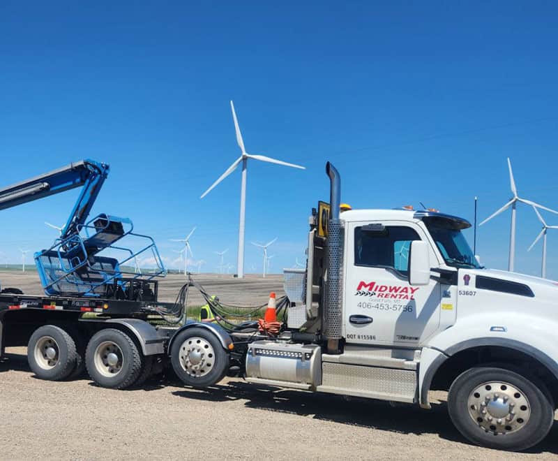 Wind turbine maintenance truck with a crane at a wind farm.