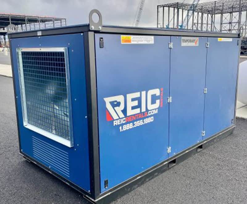 Portable blue generator rental unit with REIC branding on a construction site.