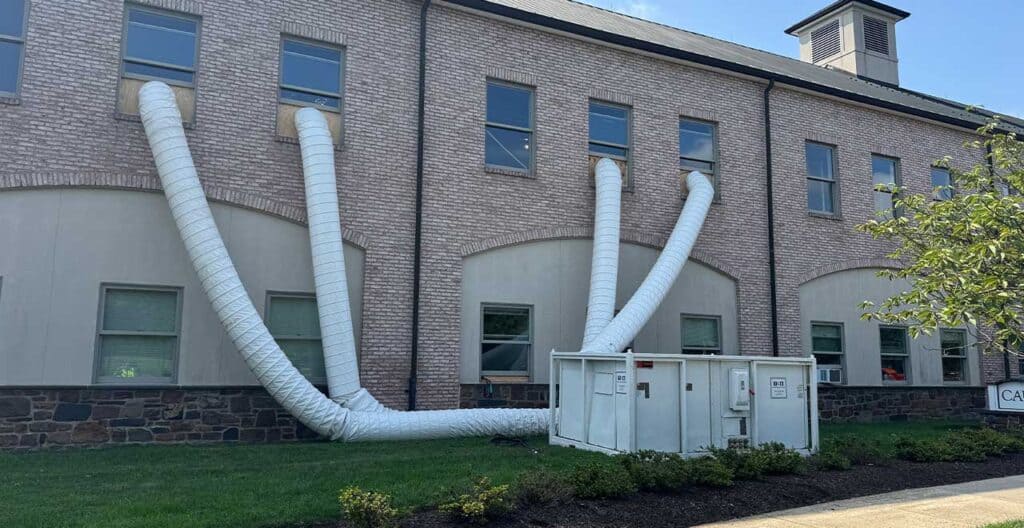 Hospital emergency cooling system with large ventilation ducts outside building.