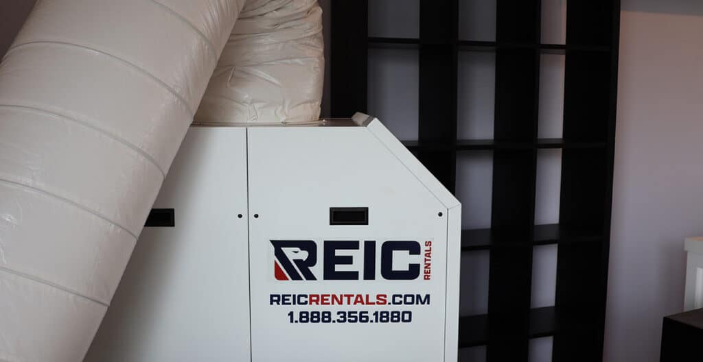 REIC Rentals storage unit with branded box in modern facility.