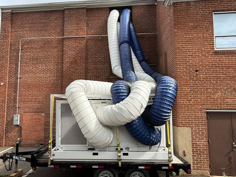 HVAC ductwork installation for commercial building at REIC Rentals.