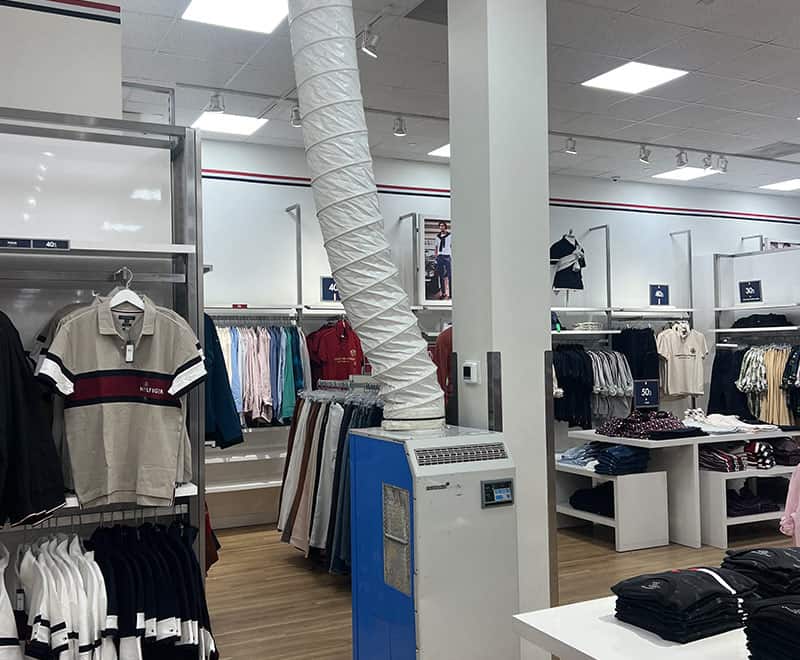 Clothing store interior with racks of casual and formal wear in Philadelphia.