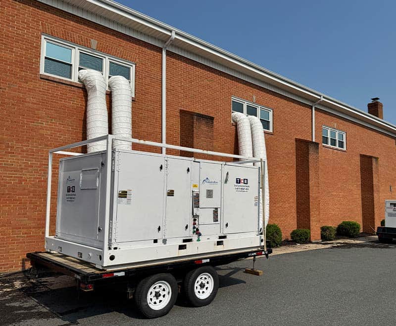 HVAC unit on trailer outside a brick building in Philadelphia.