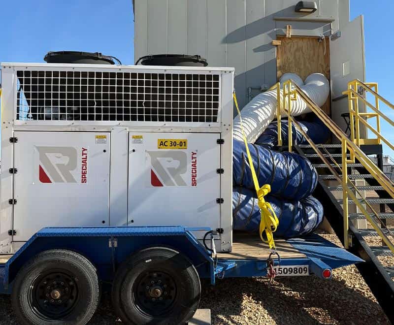 Large industrial HVAC unit with ductwork and stairs in Midland-Odessa.