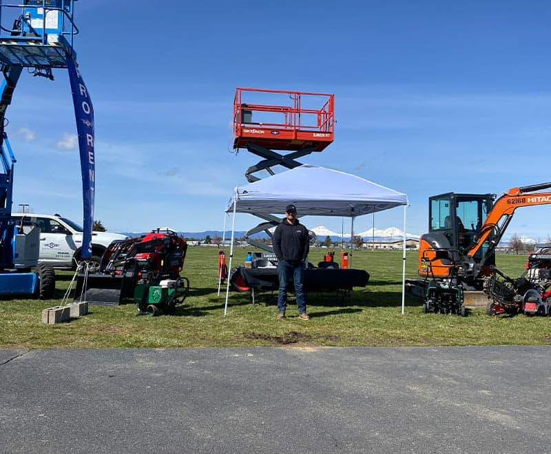 REIC Rentals equipment setup at outdoor event in Redmond.