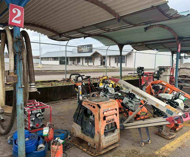 Construction tools and equipment at Seaside rental lot for property maintenance.