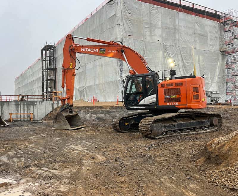 Excavator working on construction site in Twin Falls, Idaho.