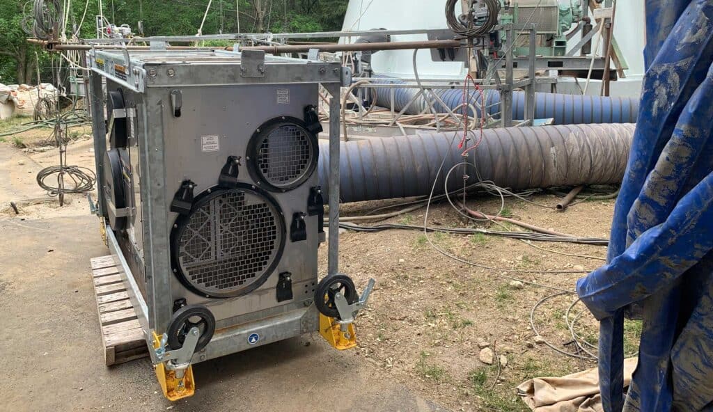Large industrial equipment and piping at petrochemical facility for maintenance.