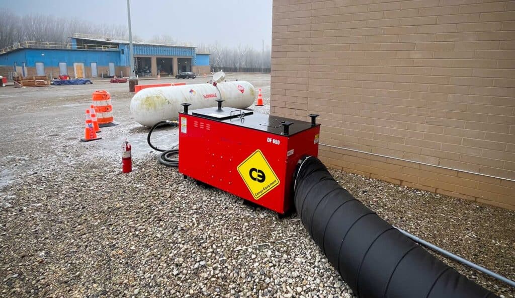 Portable temporary heater with ducting for data center construction.