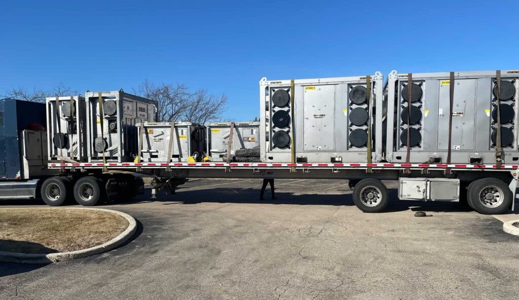 Transporting HVAC units for hospital dehumidification system installation.