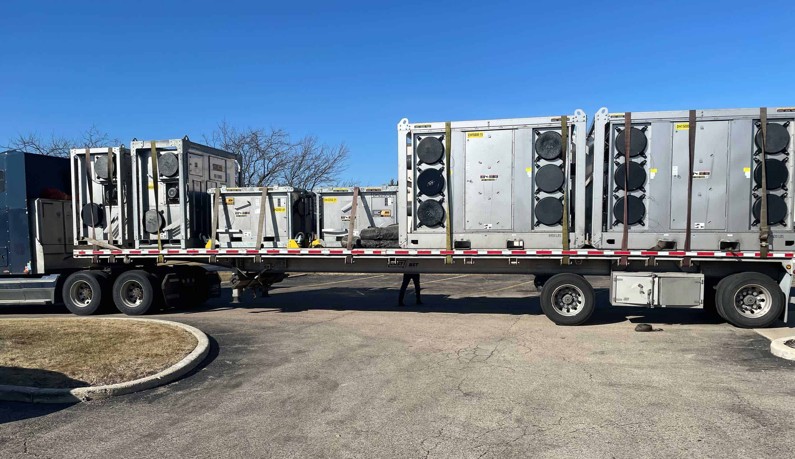 Transporting HVAC units for hospital dehumidification system installation.