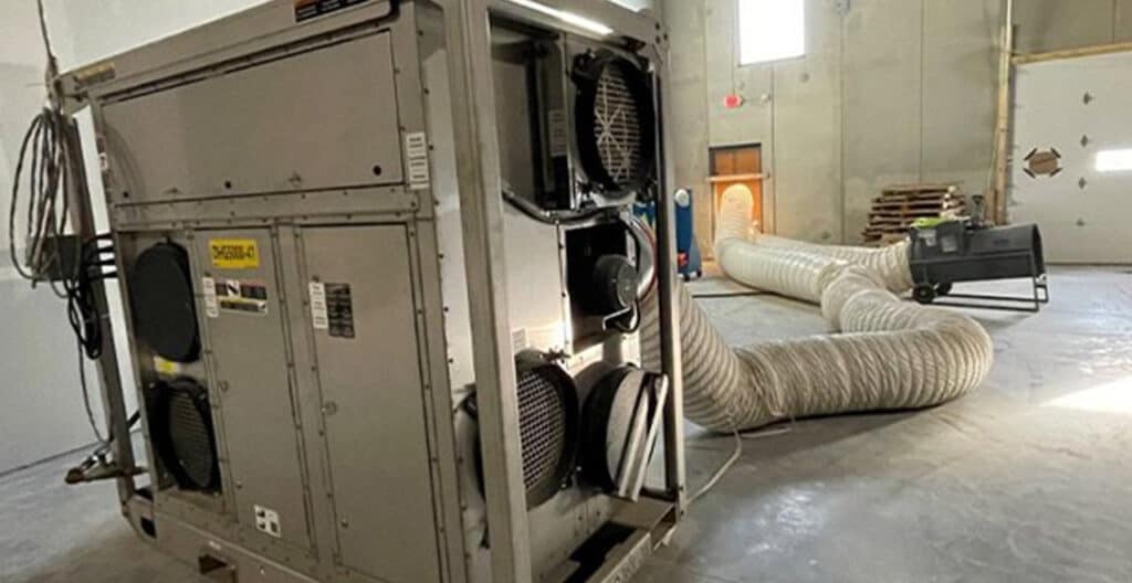 Industrial dehumidifier with ducting in a construction site.