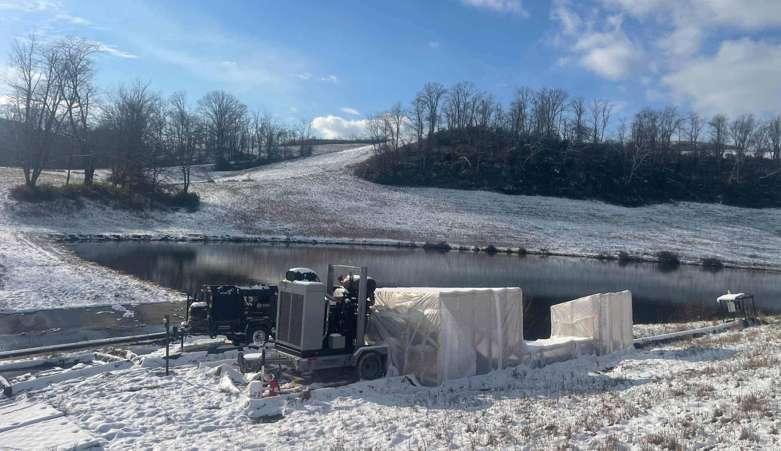 Industrial rental heater operating outdoors in snowy landscape.