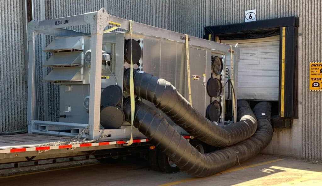 Large industrial climate control system with ducting for building material protection.