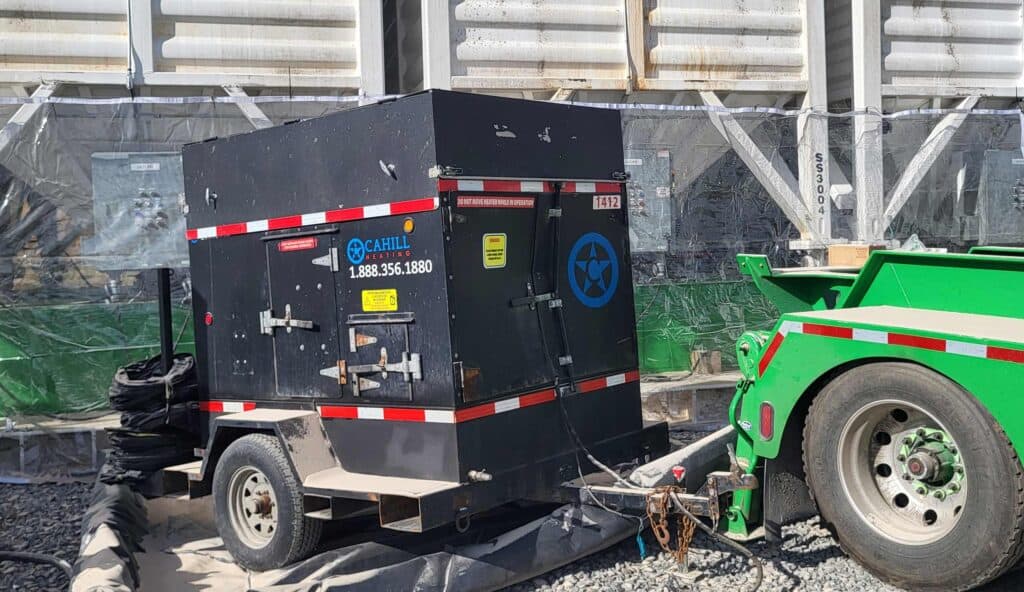 Portable diesel heater on trailer for warehouse heating and climate control.