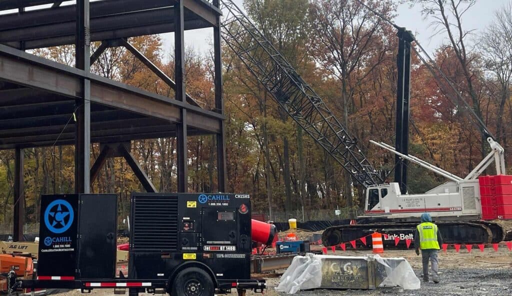Construction site with heating equipment and crane for emergency preparedness.
