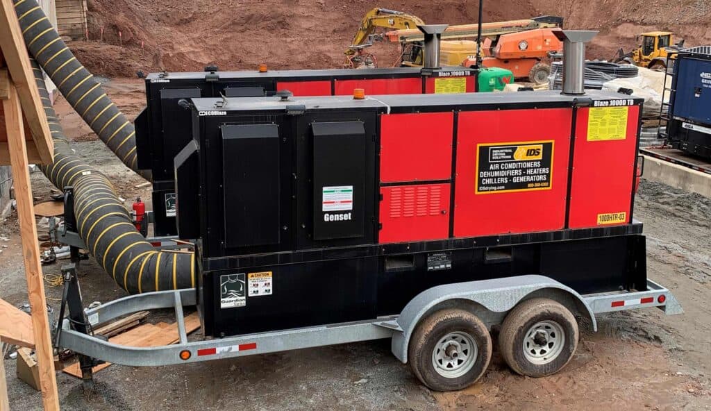 Mobile heater for concrete curing on construction sites with trailer.